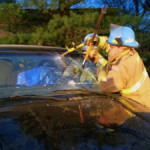 Tylar Barr cuts through the windshield using a GlasMaster hand tool