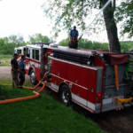 Engine 28-11 flows deck gun into French Creek at Wilson Shute boat ramp