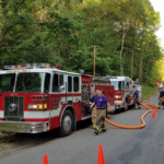 fire engines in a drafting and pumping relay drill on Townline Road