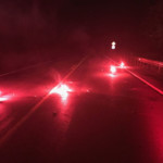 Flares block a flooded roadway in West Mead Township