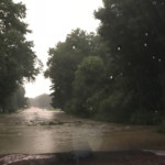 Water floods across Cochranton Road