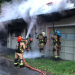 Firefighters from Meadville Central and West Mead 1 work at extinguishing a garage fire