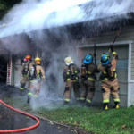 Firefighters from Meadville Central and West Mead 1 work at extinguishing a garage fire