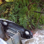 Vehicle overturned in the creek under Thurston Road